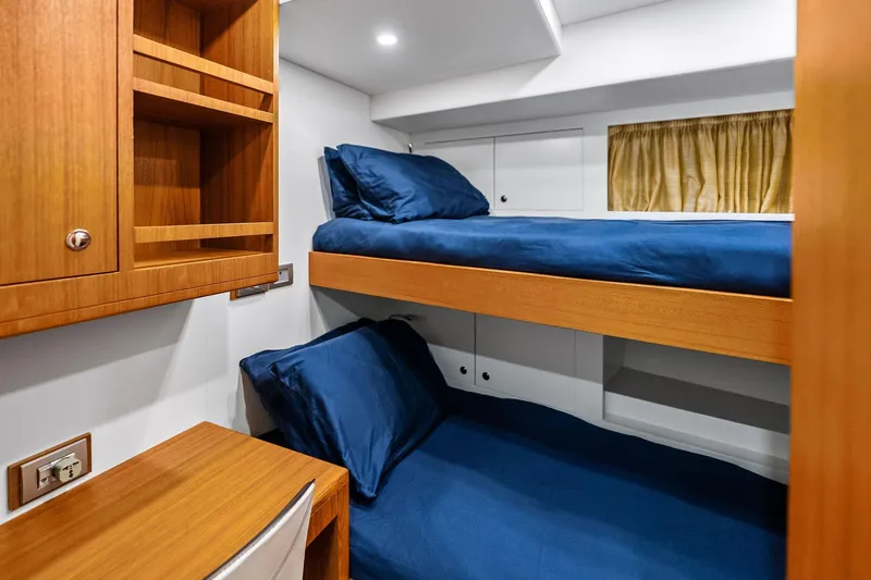 Diamond Yacht Photos Pics Bunk beds with blue bedding in 2013 AB 116 Motoryacht cabin interior.