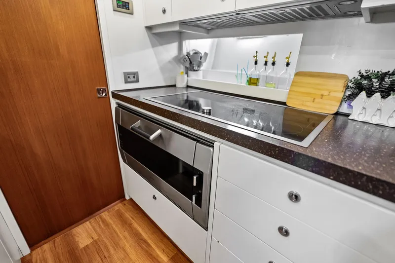 Diamond Yacht Photos Pics Modern kitchen in 2013 AB 116 Motoryacht with sleek appliances and wooden accents.