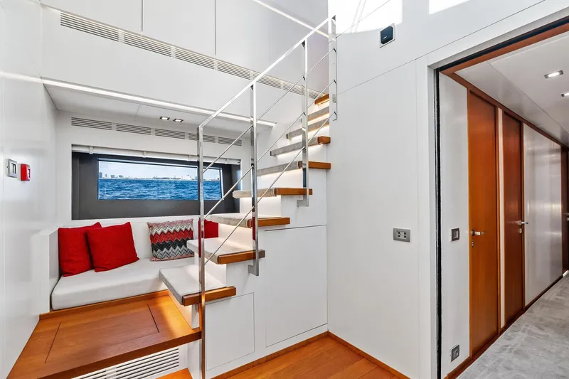 Diamond Yacht Photos Pics Luxurious interior of 2013 AB 116 Motoryacht with modern staircase and cozy seating area.