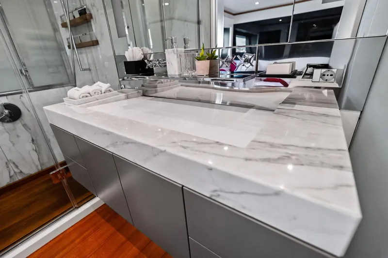 Diamond Yacht Photos Pics Luxurious bathroom vanity on 2013 AB 116 Motoryacht with marble countertop and modern fixtures.