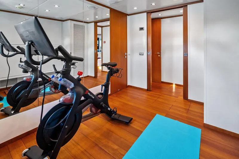 Diamond Yacht Photos Pics Home gym on 2013 AB 116 Motoryacht with Peloton bike and yoga mat.