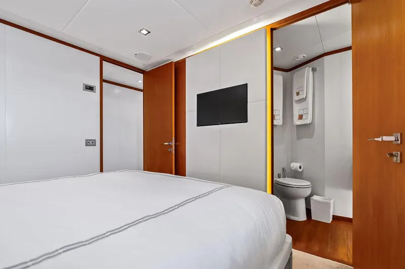 Diamond Yacht Photos Pics Luxurious bedroom and bathroom on 2013 AB 116 Motoryacht, featuring modern design and amenities.