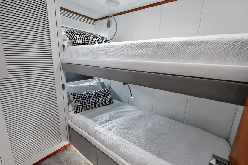 Diamond Yacht Photos Pics Bunk beds in 2013 AB 116 Motoryacht cabin with modern decor and patterned pillows.
