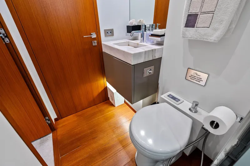 Diamond Yacht Photos Pics Luxurious bathroom on 2013 AB 116 Motoryacht with modern fixtures and wooden accents.