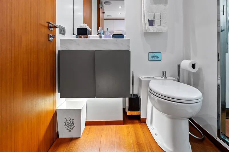 Diamond Yacht Photos Pics Luxurious bathroom on 2013 AB 116 Motoryacht with modern fixtures and wooden accents.