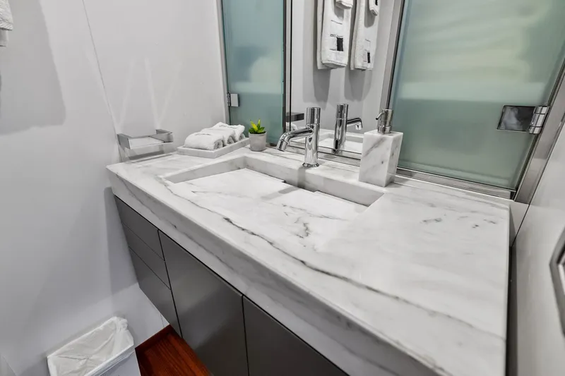 Diamond Yacht Photos Pics Luxurious marble bathroom sink on 2013 AB 116 Motoryacht, featuring modern fixtures and elegant design.