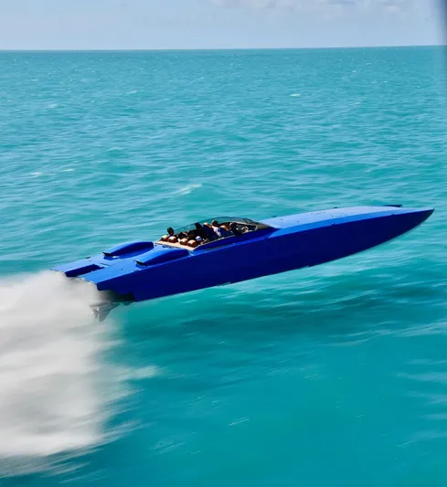  Yacht Photos Pics Blue Skater 46 speedboat racing across turquoise waters, 2013 model.