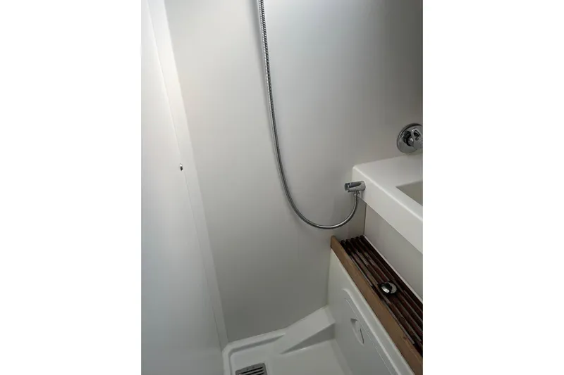 Cicerenella Yacht Photos Pics Bathroom interior of 2019 Jeanneau Sun Odyssey 440 yacht, featuring a modern shower design.