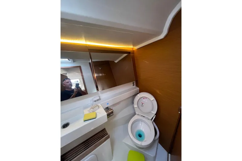 Cicerenella Yacht Photos Pics Bathroom interior of 2019 Jeanneau Sun Odyssey 440 yacht, featuring modern fixtures.