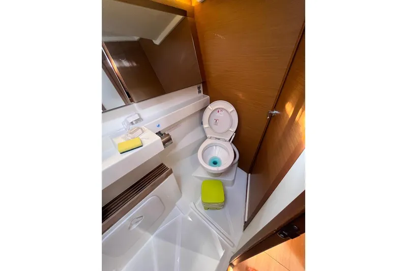 Cicerenella Yacht Photos Pics Bathroom interior of 2019 Jeanneau Sun Odyssey 440 yacht, featuring modern fixtures.