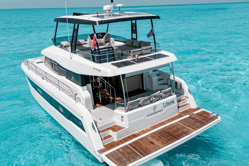 Libert'e Yacht Photos Pics 2020 Fountaine Pajot MY6 yacht cruising in clear turquoise waters.