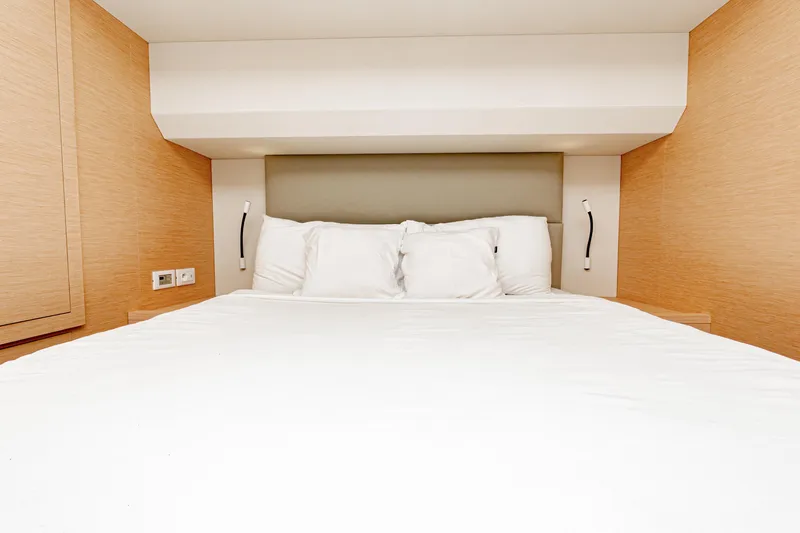 Libert'e Yacht Photos Pics Luxurious bedroom interior of 2020 Fountaine Pajot MY6 yacht with modern design.