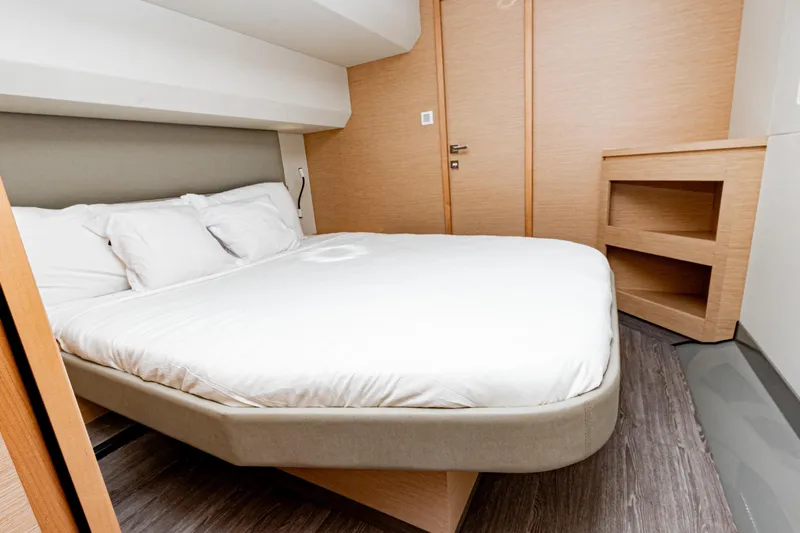Libert'e Yacht Photos Pics Luxurious bedroom interior of 2020 Fountaine Pajot MY6 yacht with modern design.