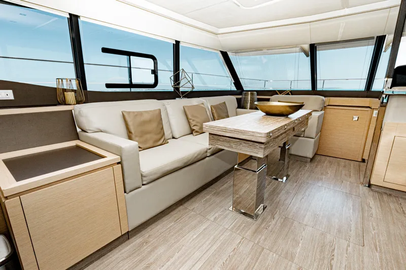 Libert'e Yacht Photos Pics Luxurious interior of 2020 Fountaine Pajot MY6 yacht with modern furnishings and elegant design.
