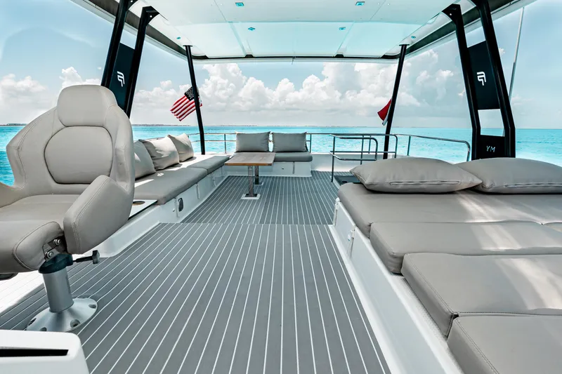 Libert'e Yacht Photos Pics Luxurious 2020 Fountaine Pajot MY6 yacht interior with plush seating and ocean view.
