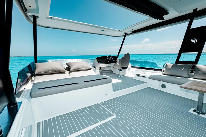 Libert'e Yacht Photos Pics Luxurious 2020 Fountaine Pajot MY6 yacht interior with ocean view and modern seating.