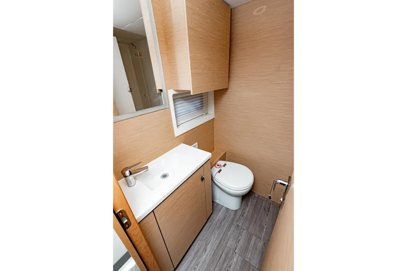 Libert'e Yacht Photos Pics Modern bathroom in 2020 Fountaine Pajot MY6 yacht with sleek sink and toilet.