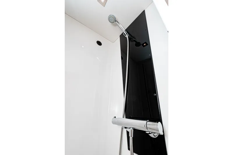 Libert'e Yacht Photos Pics Modern shower in 2020 Fountaine Pajot MY6 yacht, featuring sleek chrome fixtures.