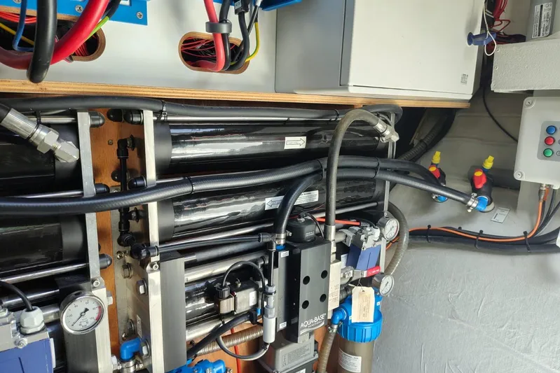 Libert'e Yacht Photos Pics Engine room of 2020 Fountaine Pajot MY6 yacht, showcasing complex mechanical systems and wiring.