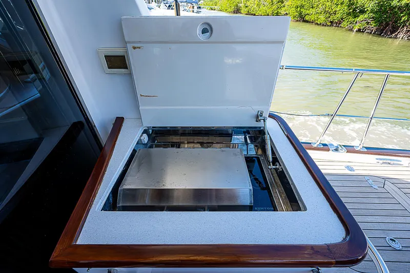 Marika Yacht Photos Pics Outdoor grill on the 2011 Hunt Yachts 52, docked by the water.