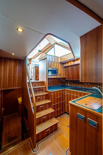 Marika Yacht Photos Pics Luxurious 2011 Hunt Yachts 52 interior with wooden cabinetry and modern kitchen.