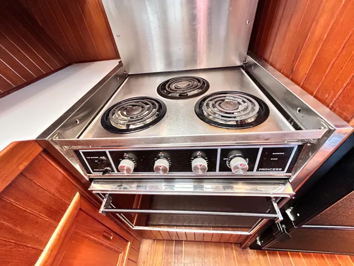  Yacht Photos Pics 1987 Marine Trader 44 Sunbridge Trawler kitchen with stainless steel stove and oven.