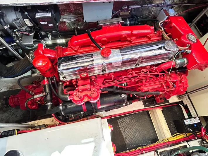  Yacht Photos Pics Engine of 1987 Marine Trader 44 Sunbridge Trawler, vibrant red components, detailed view.