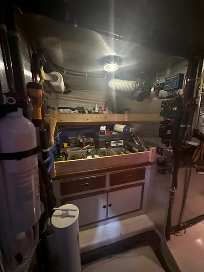 Brut Yacht Photos Pics Engine room of a 1999 Krogen Trawler with tools and equipment.