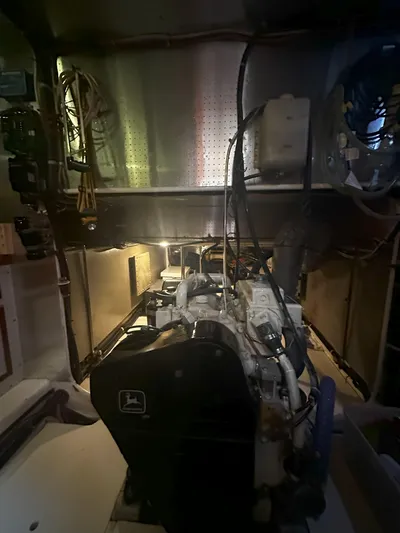 Brut Yacht Photos Pics Engine room of a 1999 Krogen Trawler, showcasing mechanical components and wiring.