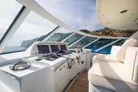 Luxurious Devonport yacht cockpit with panoramic views, featuring modern controls and plush seating, 2014 model.