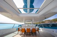 Luxurious Devonport yacht interior with dining area, panoramic ocean views, and modern design, 2014 model.