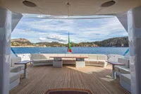 Luxurious Devonport yacht deck with seating, ocean view, and flag, 2014 model.