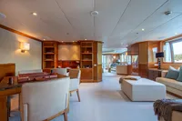 Luxurious yacht interior with elegant furnishings, wooden accents, and ample natural light, Devonport 2014.