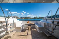 Luxurious Devonport yacht deck with seating, table, and ocean view, 2014 model.