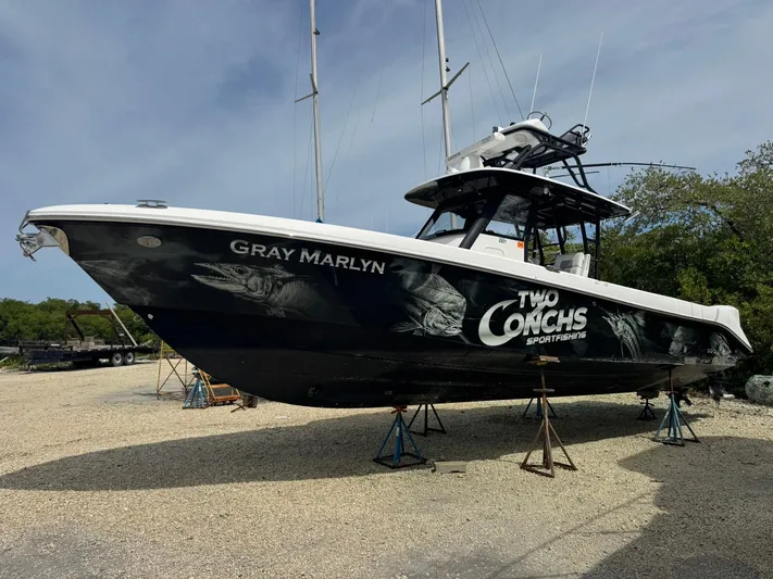  Yacht Photos Pics 2016 Everglades 355 Tournament boat on stands, featuring "Gray Marlyn" and "Two Conchs Sportfishing" graphics.