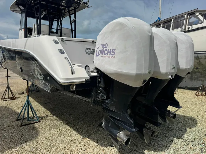  Yacht Photos Pics 2016 Everglades 355 Tournament boat with triple outboard engines on stands.