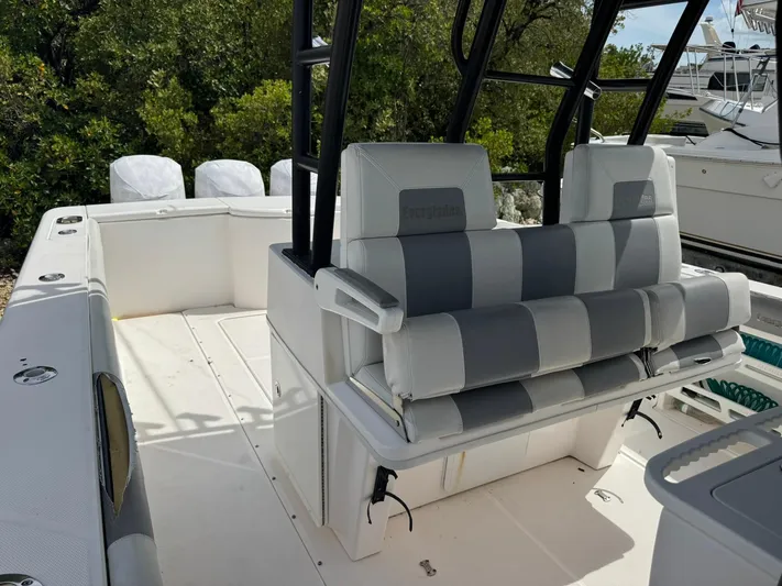  Yacht Photos Pics 2016 Everglades 355 Tournament boat interior with cushioned seating and fishing rod holders.