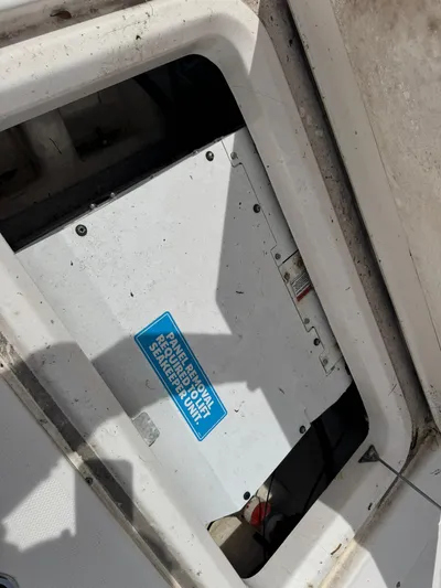  Yacht Photos Pics 2016 Everglades 355 Tournament boat compartment with service panel and blue label.