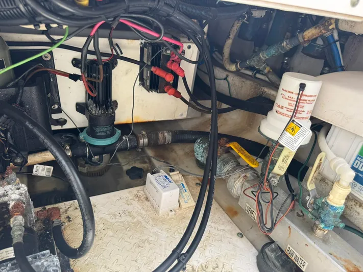  Yacht Photos Pics Engine compartment of a 2016 Everglades 355 Tournament boat, showing wiring and plumbing components.