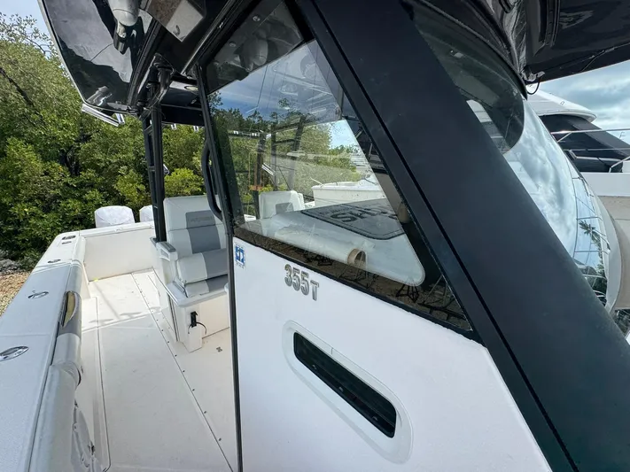  Yacht Photos Pics 2016 Everglades 355 Tournament boat, side view with seating and console details.