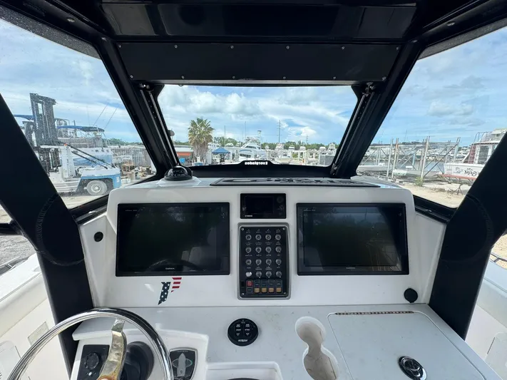  Yacht Photos Pics 2016 Everglades 355 Tournament boat dashboard with dual Garmin displays and control panel.