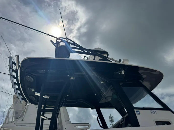  Yacht Photos Pics 2016 Everglades 355 Tournament boat under cloudy sky with sun rays.