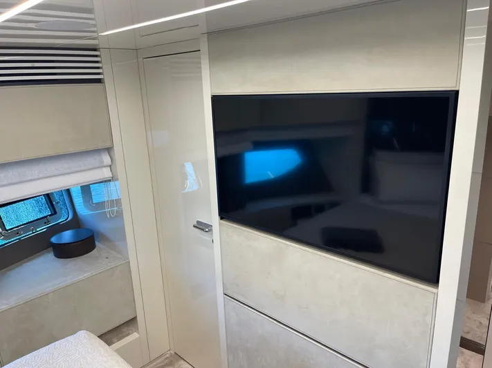  Yacht Photos Pics Interior of 2022 Cranchi Settantotto 78 yacht with modern design and large TV.