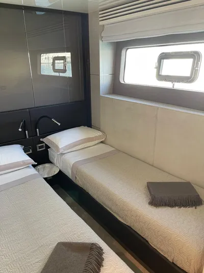  Yacht Photos Pics Interior cabin of 2022 Cranchi Settantotto 78 yacht with twin beds and modern decor.