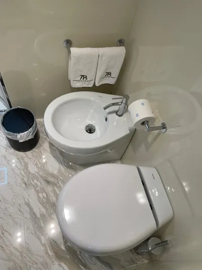  Yacht Photos Pics Luxury bathroom in 2022 Cranchi Settantotto 78 yacht with modern fixtures and elegant design.