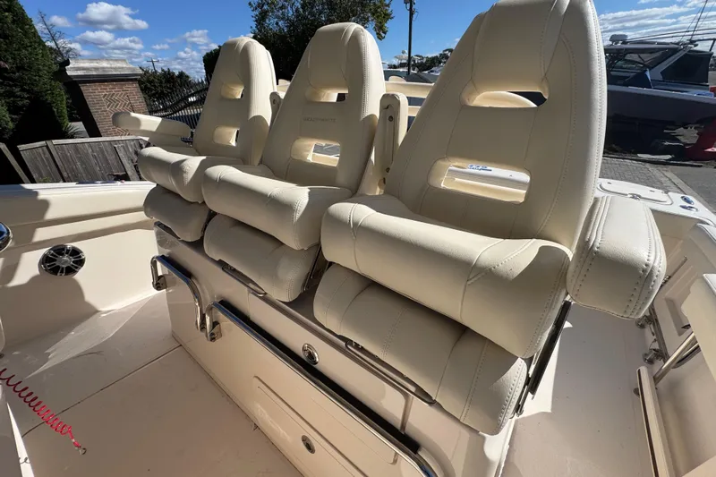  Yacht Photos Pics Luxury seating on 2022 Grady-White Canyon 326 boat, featuring plush, cream-colored upholstery.