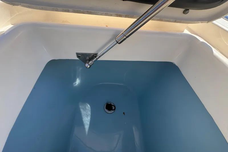  Yacht Photos Pics Livewell interior of 2022 Grady-White Canyon 326 boat, featuring hydraulic support.