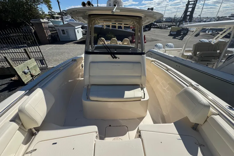  Yacht Photos Pics 2022 Grady-White Canyon 326 boat interior with seating and helm station.