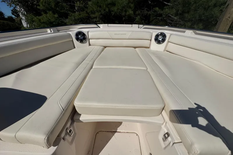  Yacht Photos Pics 2022 Grady-White Canyon 326 boat interior with cushioned seating and speakers.