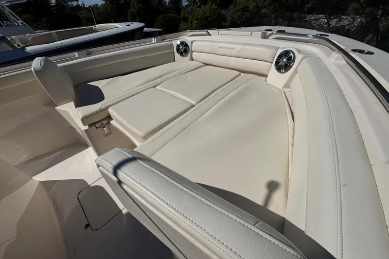  Yacht Photos Pics 2022 Grady-White Canyon 326 boat interior with cushioned seating and speakers.